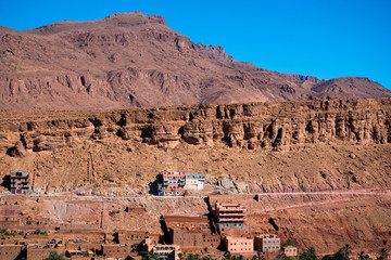 Wall Mural - Landscape view of Atlas mountains and houses in Todra gorge in Tinghir, Morocco