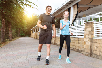 morning running in men and women, training before work, two people athletes