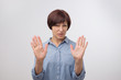 © Viktor Koldunov - Portrait of mature woman making stop sign with her hand. She is refusing to accept news.