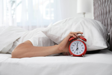 Sticker - Man turning off alarm clock in bedroom