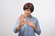 © Viktor Koldunov - Portrait of mature woman making stop sign with her hand. She is refusing to accept news.