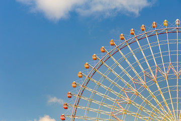 Tokyo giant ferris wheel against blue sky background