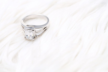 Beautiful diamond ring on white fabric