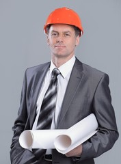 portrait of professional architect with the project of a new building.