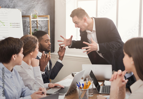 Fotografie, Obraz Angry business man screaming at employee in office