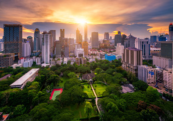 Fototapete - Aerial view of Bangkok skyline and skyscraper with sunset sky on Sukhumvit road center of business in Bangkok city downtown Thailand.