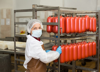 Woman with sausage trolley