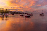 Fototapeta Boho - Colorful sunrise on the marina of Lausanne on the Lake Leman in summer with the view of the Swiss Alps in background - 2