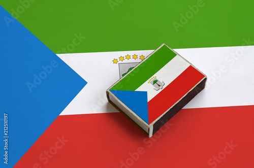 Fotografía Equatorial Guinea flag is pictured on a matchbox that lies on a large flag