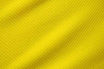 Yellow color football jersey clothing fabric texture sports wear background, close up