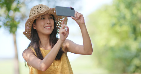 Sticker - Travel woman taking photo at outdoor