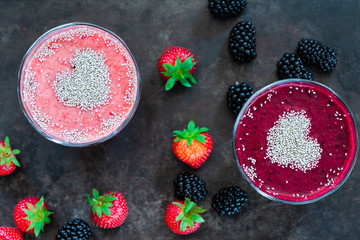 Sticker - Strawberry and blackberry smoothies garnished with chai seeds - top view. Healthy breakfast idea.