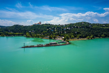 Wall Mural - Tihany, Hungary - The harbor of Tihany by Lake Balaton with the famous Benedictine Monastery of Tihany (Tihany Abbey, Tihanyi Apátság) at background with beautiful turquoise water