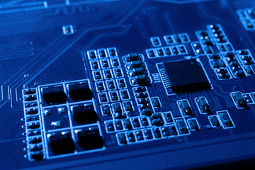 Poster - Electronic circuits in futuristic technology concept. Motherboard computer on blue background. Microchip digital data