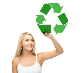 waste recycling, reuse, environment and ecology concept - happy woman drawing green recycle symbol over white background