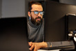© Syda Productions - deadline, technology and people concept - close up of creative man in glasses working at night office and thinking