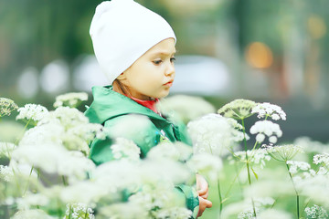 little girl on an autumn walk in the park