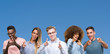 © Krakenimages.com - Composition of group of friends over blue blackground pointing fingers to camera with happy and funny face. Good energy and vibes.