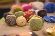 Multicolored Wool Kept On Table 