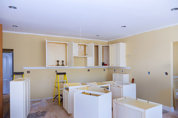 Wall Mural - Installation of kitchen installs kitchen cabinet. Interior design construction kitchen