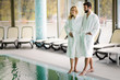 © NDABCREATIVITY - Beautiful cheerful couple relaxing in spa center