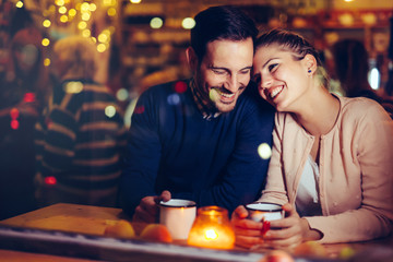 Wall Mural - Romantic couple dating in pub at night