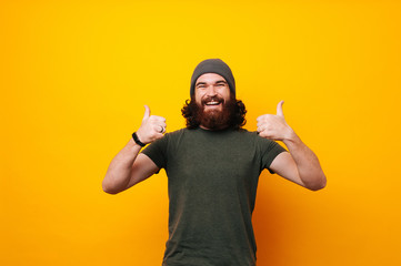 Wall Mural - happy funny bearded man show sight thumbs up and good luck