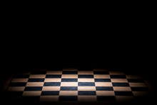 Abstract Chessboard On Dark Background Lighted With Snoot