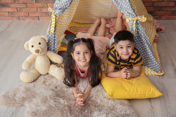 Canvas Print - Playful little children in handmade tent indoors