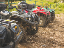 Parked In A Row Several Atv Quad Bikes Extreme Outdoor Adventure Concept