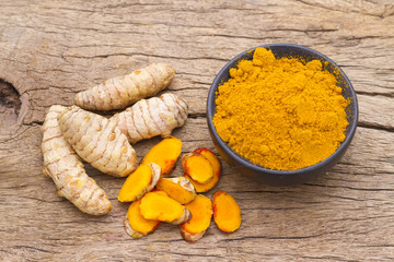 Canvas Print - turmeric in bowl on table, top view