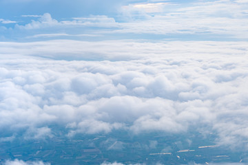 big blue sky and cloud and city under cloud top view from airplane window,nature background.