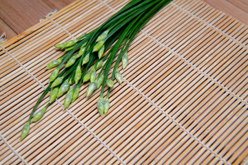 A bunch of fresh Garlic chives flowers (green Nira grass), isolated on white background.