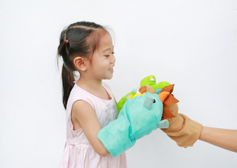 Wall Mural - Little Asian child girl hands playing animal puppets on white background. Educations concept.