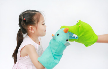 Wall Mural - Little Asian child girl hands playing animal puppets on white background. Educations concept.