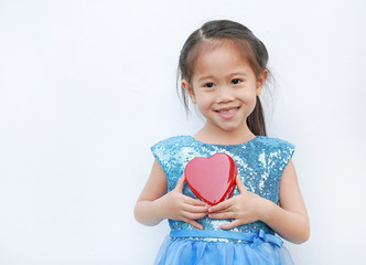 Cute little child girl holding red heart gift box for Valentine's Day isolated on white background.