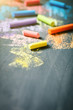 © Anna - Colorful crayons on the blackboard, drawing. Back to school background.