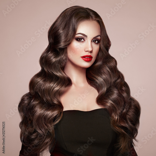 Brunette Girl With Long Healthy And Shiny Curly Hair Care