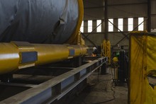 Welder Repairing Vessel Parts In Factory
