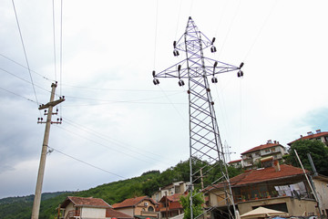 electrical towers with wires for electricity in the center of the city. electrical towers between ho