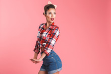 Portrait Of A Smiling Brunette Pin-up Girl In Plaid Shirt