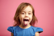 © Ilshat - Isolated portrait of kid girl with wide open mouth and protruding tongue.