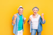 © deagreez - Scream shout rest relax weekend conquer team unity concept. Photo portrait of cheerful amazed crazy modern beautiful funky cool old parents guy rejoicing showing fists isolated on bright background