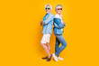 Style swag cool people concept. Photo portrait of two funny funky excited confident with toothy beaming smile gentleman lady standing back wearing denim casual clothes isolated bright background
