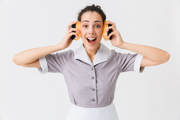 Wall Mural - Portrait of an excited young housemaid