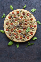 Canvas Print - Homemade oven-baked  italian  focaccia - focaccia Barese, with olives, olive oil, tomatoes, herbs