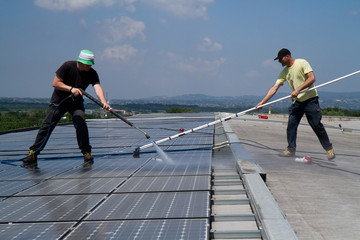 Wall Mural - washing and cleaning photovoltaic panels