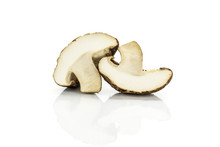 Group Of Two Halves Of Fresh Raw Brown Shiitake Mushroom Isolated On White.