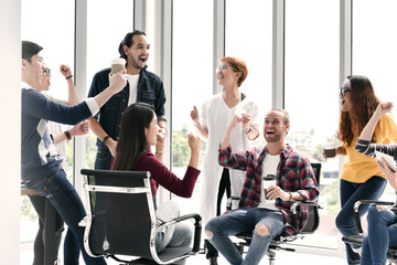 Group of businesspersons feeling happy and cheering successful work