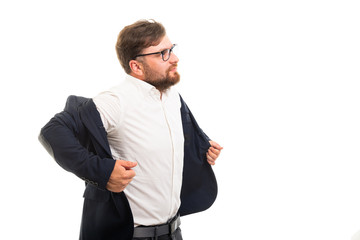 Wall Mural - Portrait of business man taking off his jacket gesture.